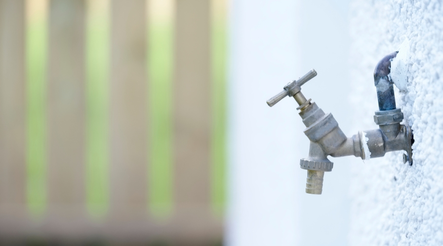 Hose bibs on the outside of a house