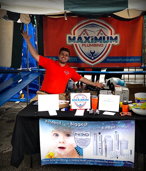 Maximum Plumbing team member at a trade show